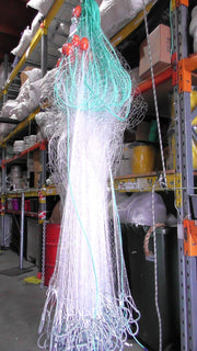 Mullet Nets displayed in a fishing supply warehouse, showcasing multi mono mesh construction for effective fishing.