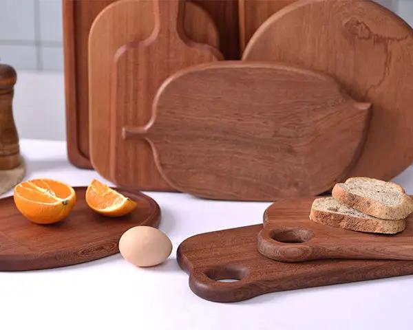Creative Solid ebony chopping board, wooden kitchen cutting board, multi-functional bread board and serving tray. by Resin Art NZ