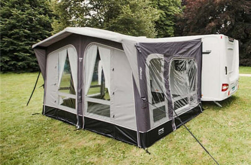 Vango Riviera 390 Awning Elements Pro Shield set up outside a caravan in a grassy area.