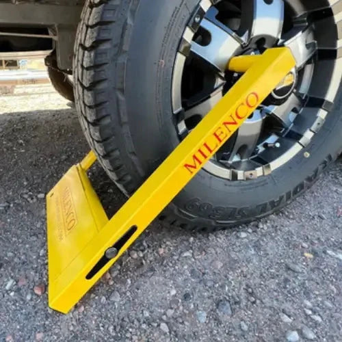 Milenco Australian Compact Wheel Clamp and Lock securing a vehicle wheel, designed for anti-theft protection.