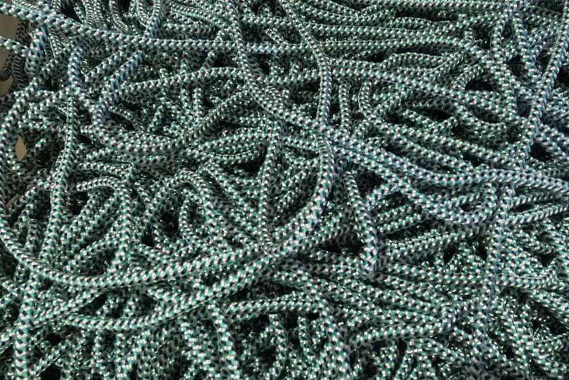 5mm Braided lead core  rope x1 m displayed in a tangled pile of green and black braided rope.