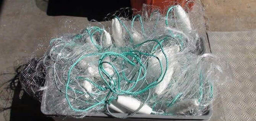 NZ made floating mullet fishing net piled in a container showing its floating design and durable materials.
