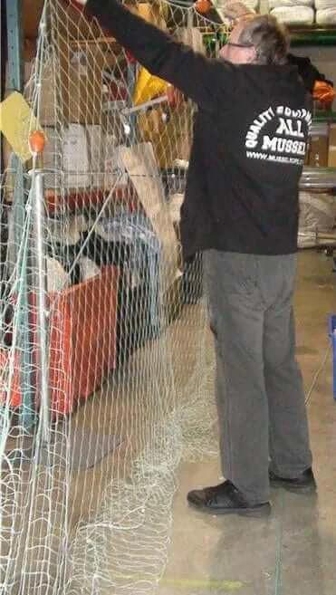 NZ Made Flounder Beach Drag Nets 15m 25m 20m 30m & 40m being handled in a storage area.