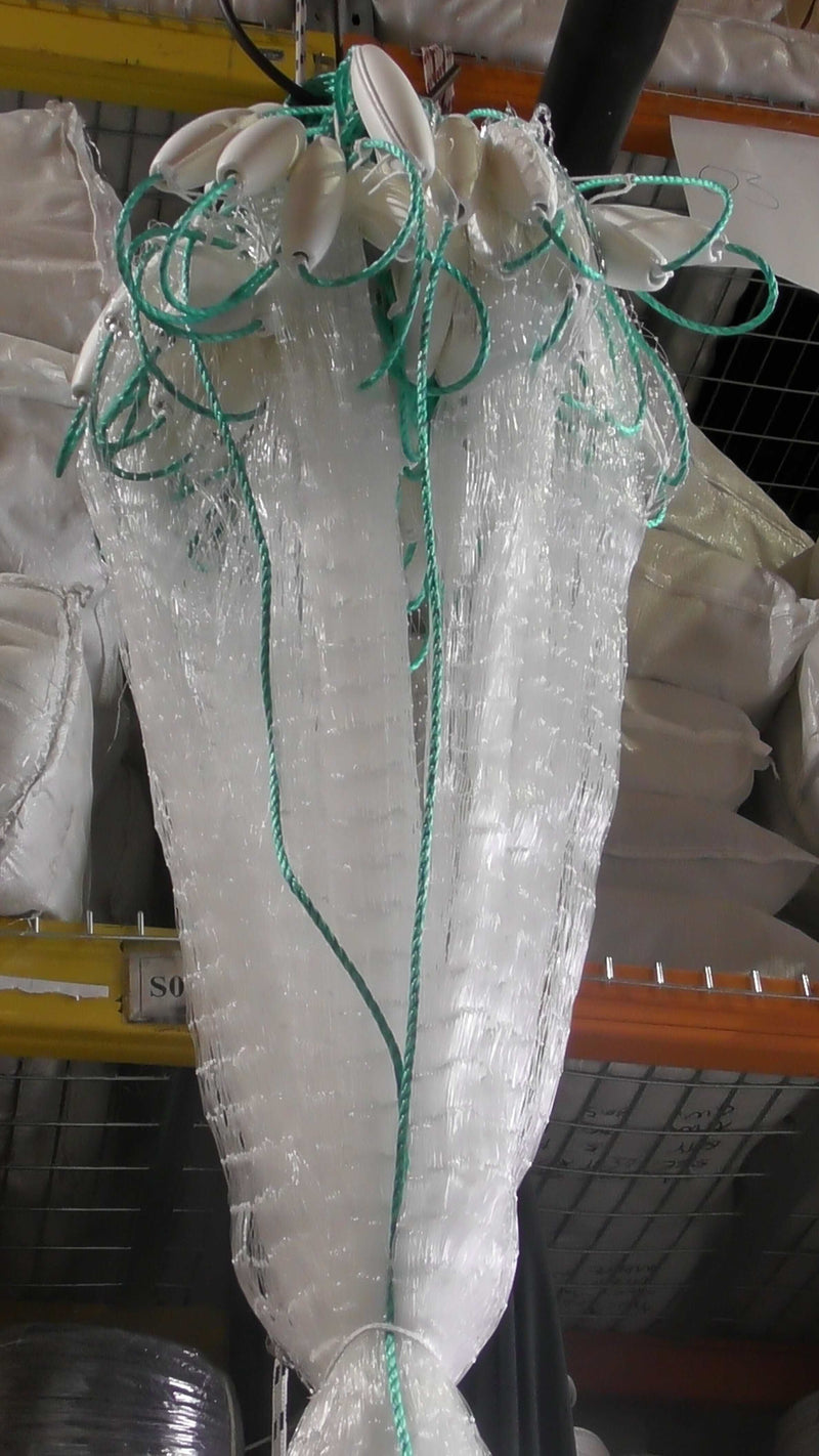 Strong 2-inch x 0.60mm  Pacific island net 30m 40m 60m 100m hanging in storage, showcasing durable mesh design.