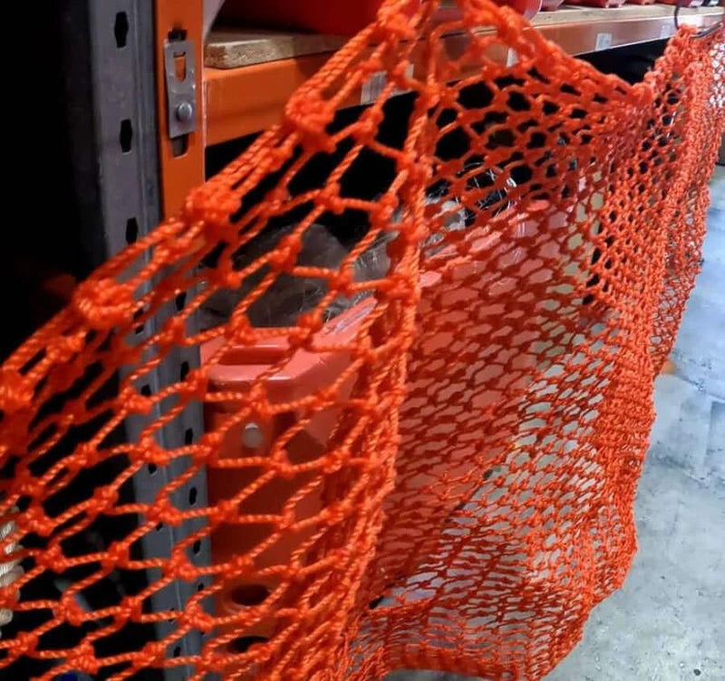 Cray Pot Mesh 60ply 3inch 20MD Orange per meter hanging on display, showcasing its strong, durable, heavy-duty quality.
