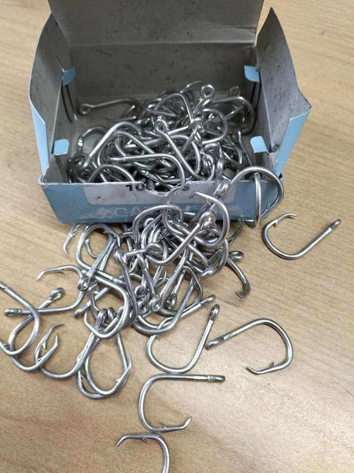 Longline Hooks 20202R - Galvanised X 100 Hooks in a box with scattered hooks on a wooden surface.