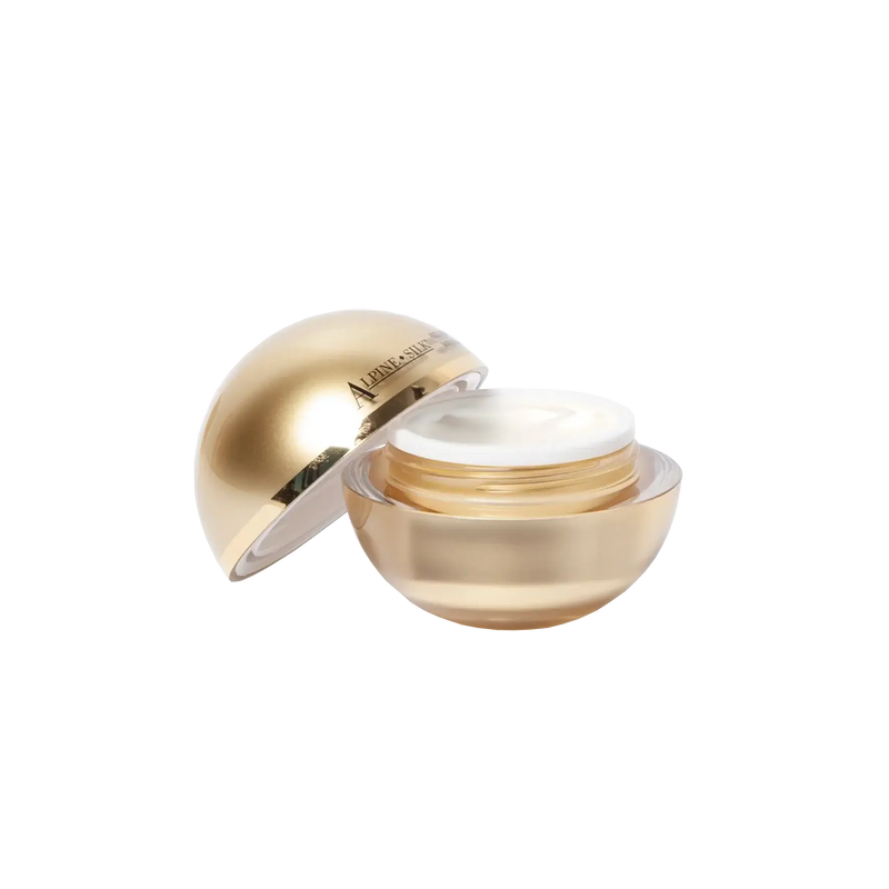 Alpine Silk Bee Venom Face Cream 30g in a stylish gold container with a lid open, showcasing the cream inside.