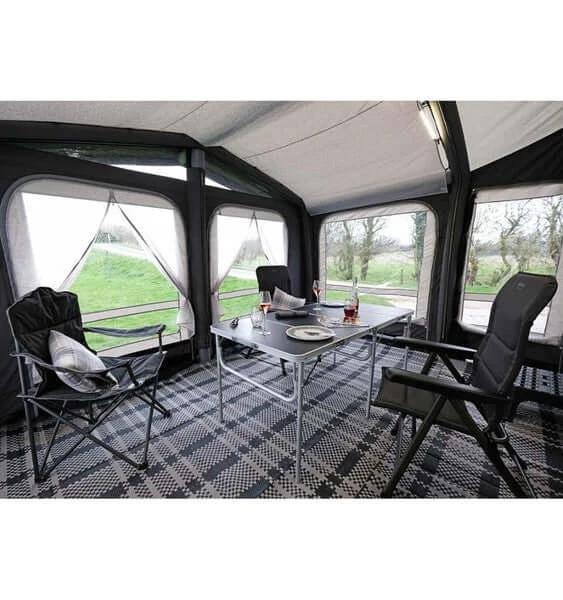 Breathable Fitted Carpet - Montelena - 3.25 x 2.0m showcased in a caravan awning interior with chairs and dining table.