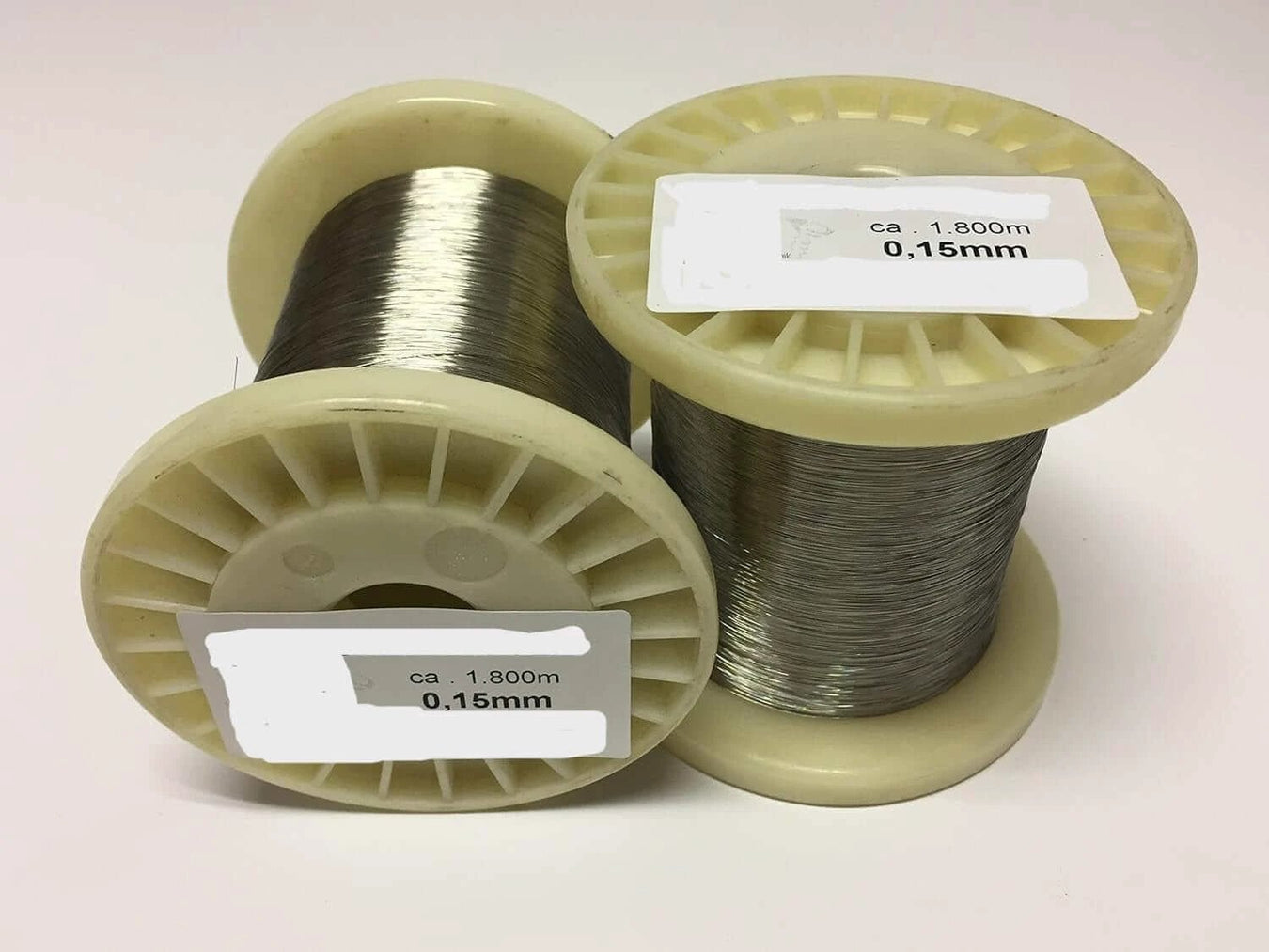 Stainless Steel Fishing Wire 0.72mm to 2.0mm x 100m spools displaying wire diameters of 0.15mm and 1.800m length.