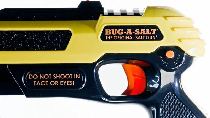 Bug-A-Salt 3.0 Yellow salt gun with safety warning for fly elimination.