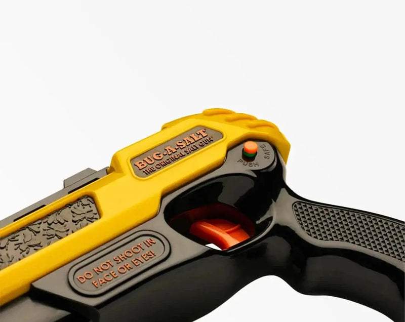 Bug-A-Salt 3.0 Yellow fly shooting gun with black grip and warning label.