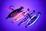Baby Boss 20g fishing lures with holographic colors and glow under UV light, perfect for targeting snapper and other fish species.