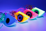 Catch Beady Eye Kabura 60g 80g 100g 120g 150g with Glow and UV - colorful jigs with holographic eyes under UV light.