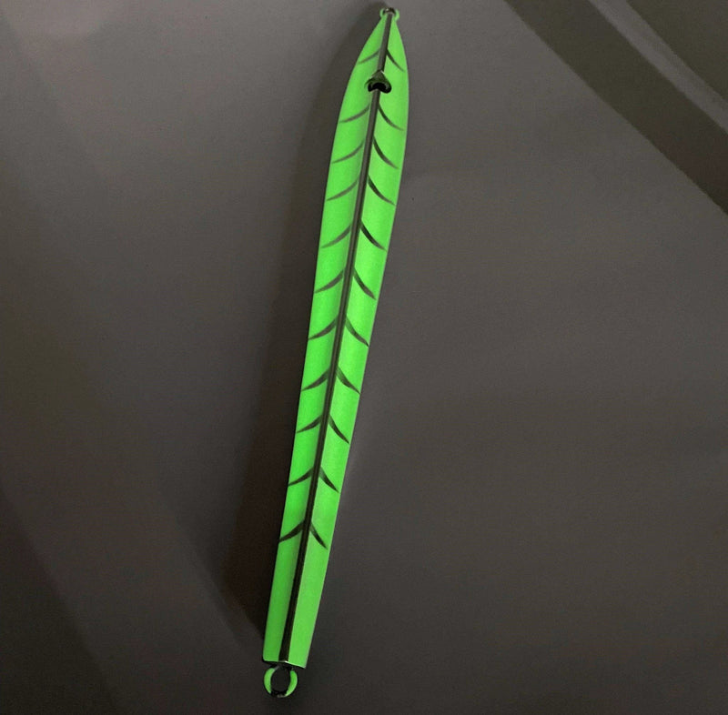 Catch Long John Slide - a vibrant green fishing lure designed for kingfish with low profile fins for darting motion.