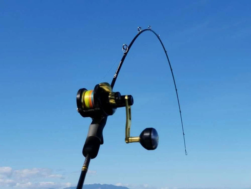 Catch Kensai Slow Pitch Jigging Acid Wrap Rod bent during use against a clear blue sky.