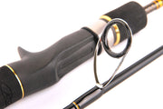 Detail of the Catch Kensai Slow Pitch Jigging Acid Wrap Rod, showcasing the grip and guide design.