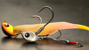 Catch Stingaz Tenya Jig Heads with Gripper 28g on a black surface featuring soft bait and hooks.
