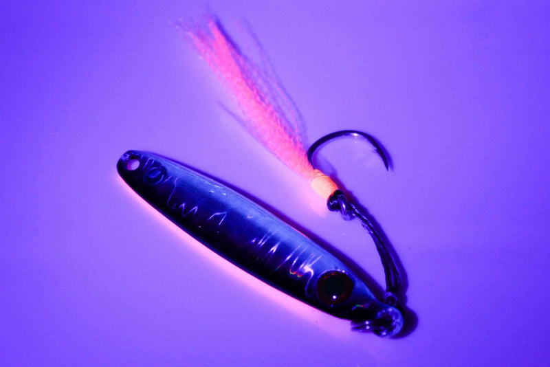 Catch Pocket Rocket Tungsten micro jig with a vibrant tail and treble hook, ideal for slow-bite fishing.