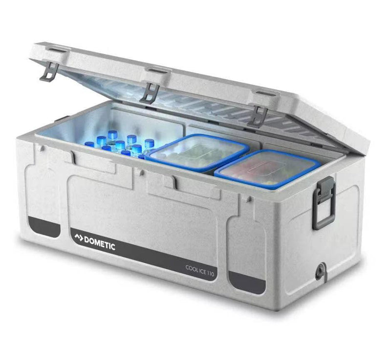 Dometic 111 Litre Cooler Box open with drinks and food containers inside, showcasing efficient ice retention.