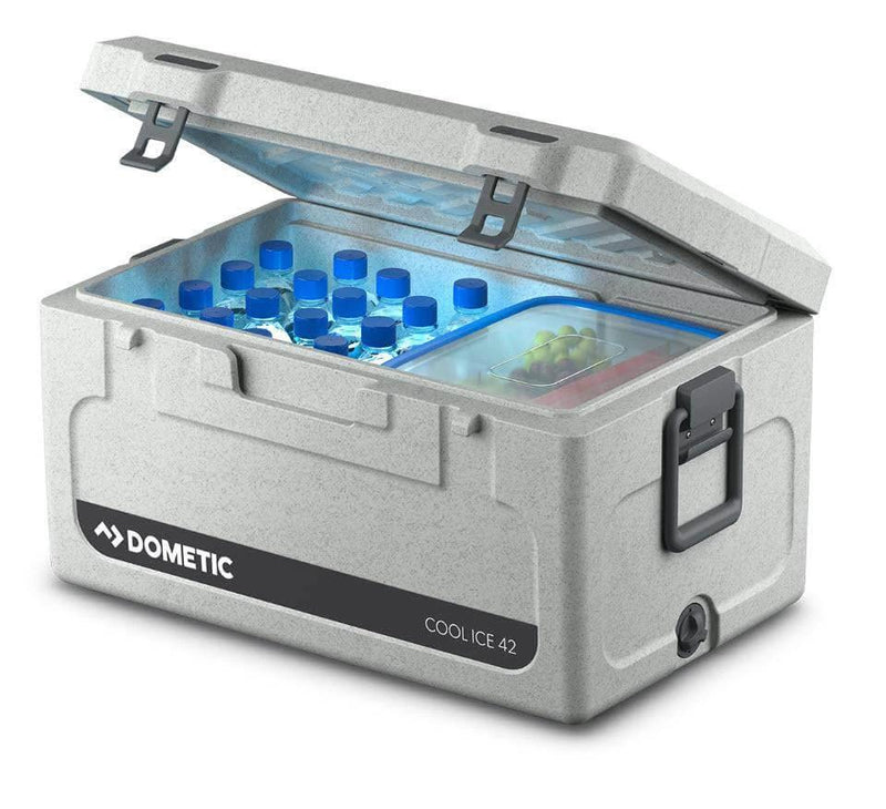 Dometic 43 Litre Cooler Box with ice and drinks inside, showcasing its efficient insulation and design.