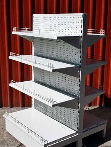 Doublesided Dairy Shelving New - Standard Kitset Racking/Shelving with pegboard and shelves for displaying goods.