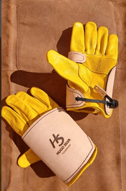 Hugo Silva Heavy Tackle Gloves Large to XX Large on a leather background, showcasing protective yellow leather design.