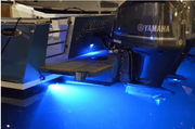 Seablaze Mini Led Underwater Light - Spectrum illuminating a boat's transom with vibrant blue light.