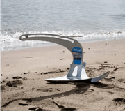 Manson Boss Anchor resting on the beach, showcasing its multi-purpose design for various seabeds.