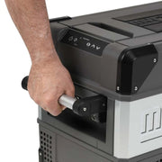 Person using the handle on MyCoolman Portable Fridge 36L Single Zone AC-DC to move it.