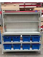 New Longspan Industrial Assembly Bench with blue storage bins and multiple shelves for warehouse organization.