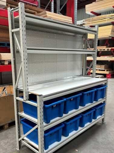 New Longspan Industrial Assembly Bench with heavy duty storage bins in warehouse setting.