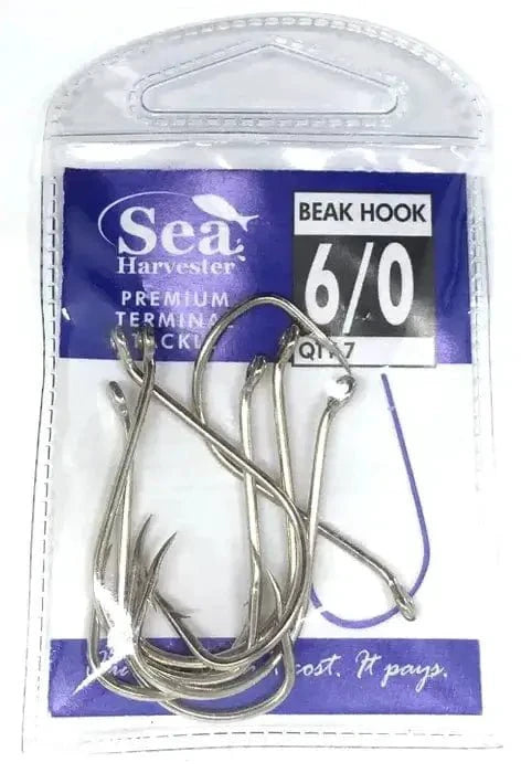 Nickle Beak Hook 6/0 Pkt 7 in a clear package, featuring chemically-sharpened points and a ringed eye.