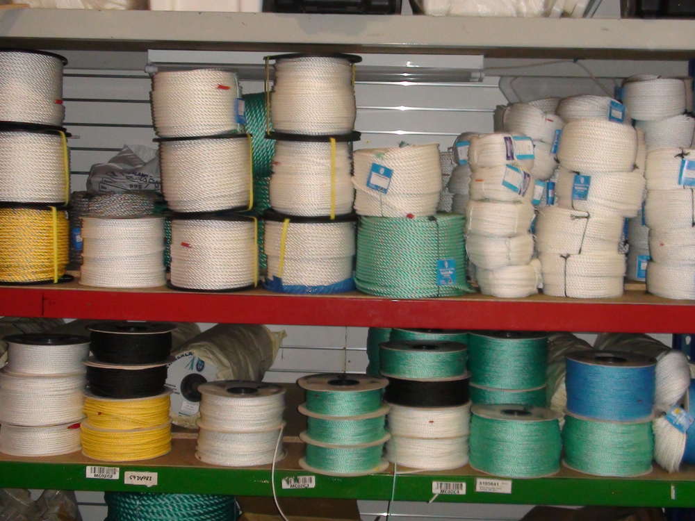 NZ high-quality PPE ropes displayed on shelves, showcasing various sizes and colors for marine and industrial use.