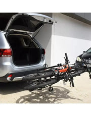 XF2 Large Fold-up/Tilting 2 Bike Rack attached to a car, showing bikes securely mounted and hatchback open.