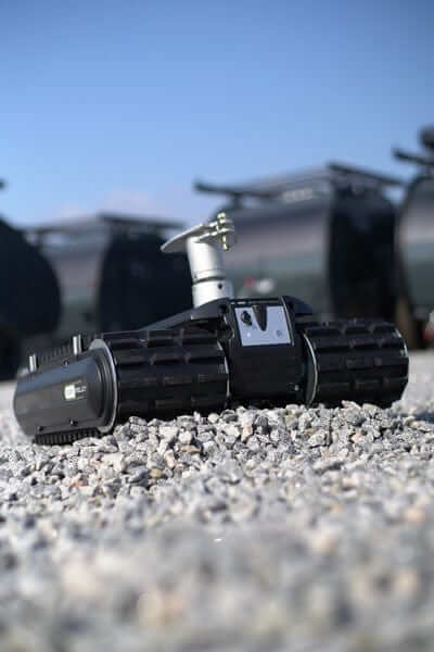 Robot Trolley Black RT2500RS G3 (up to 2500kg) Remote Controlled on gravel surface.