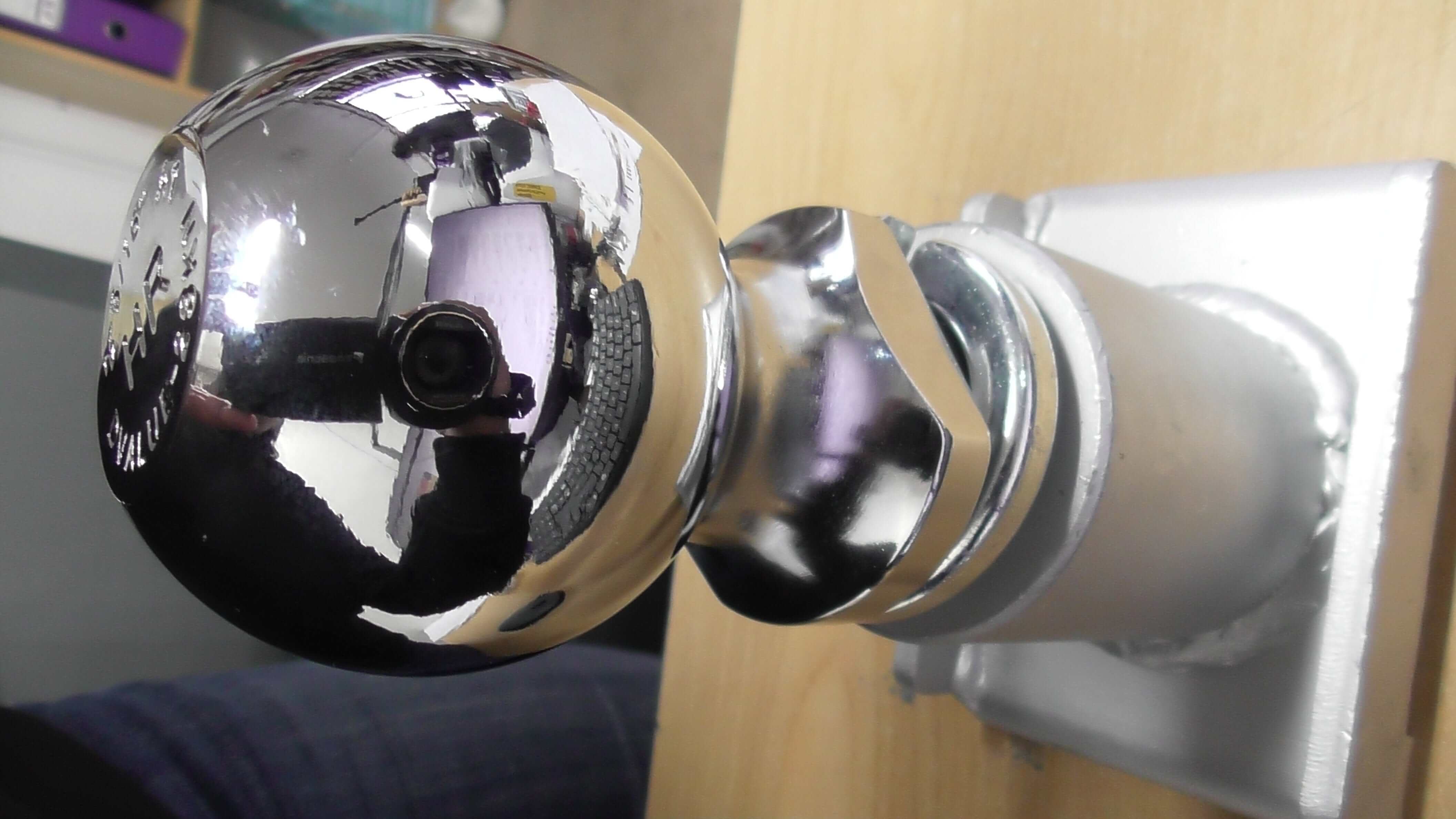 Trailer Ball Bracket for Robot Trolley 2- 5/16 Tow ball close-up view of chrome tow ball mount fixture.
