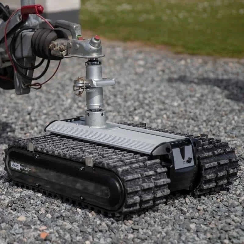 Trailer Ball Bracket for Robot Trolley 2- 5/16 Tow ball attached to robot trolley on rocky surface.