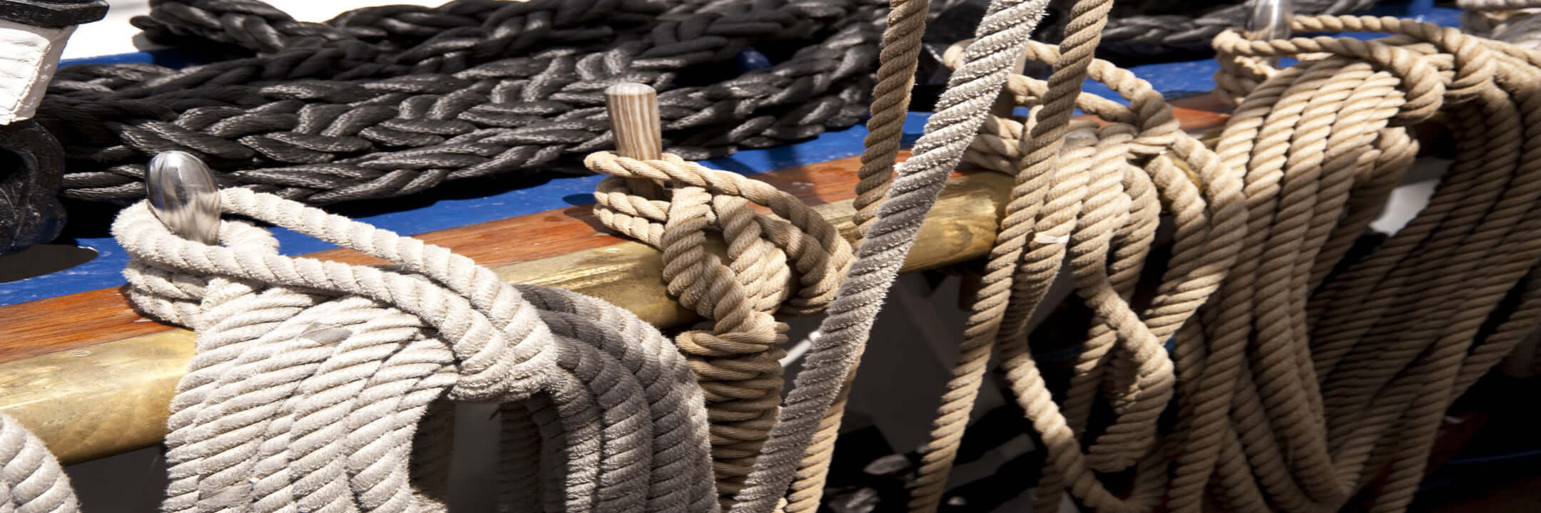 Close-up of ropes and chains on a boat deck