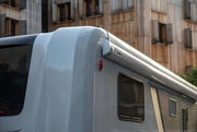 5200 ThuleWall Awning Grey 4.5m long installed on a caravan side, showcasing its sleek design and color.