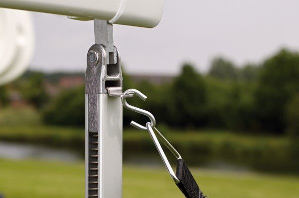 Thule awning hold down straps attached to support leg, ensuring stability and protection for the awning.