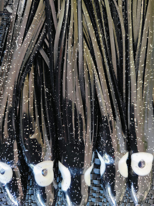 Black Octopus Skirts - 150mm 5pcs showcasing luminous eyes and glossy black finish for enhanced fishing rigs.