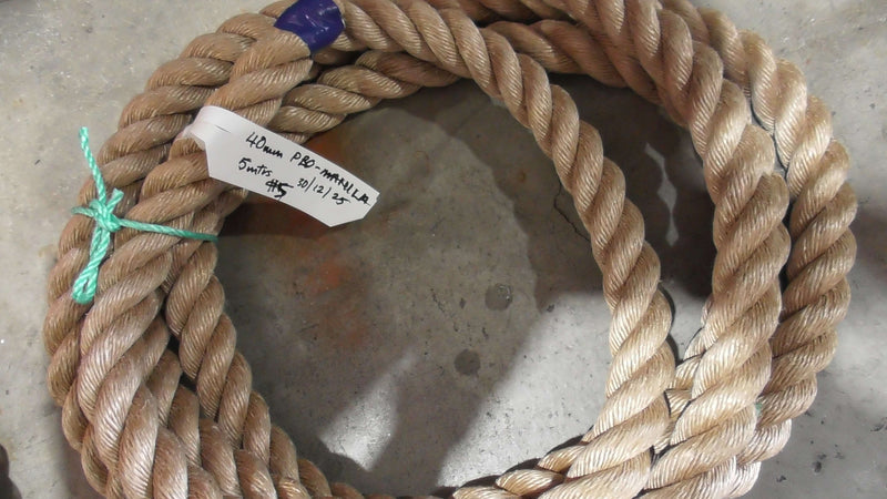 Special Pro-Manila Rope Shorts 40mm x 5 meters displayed on a concrete surface, showcasing its unique texture.