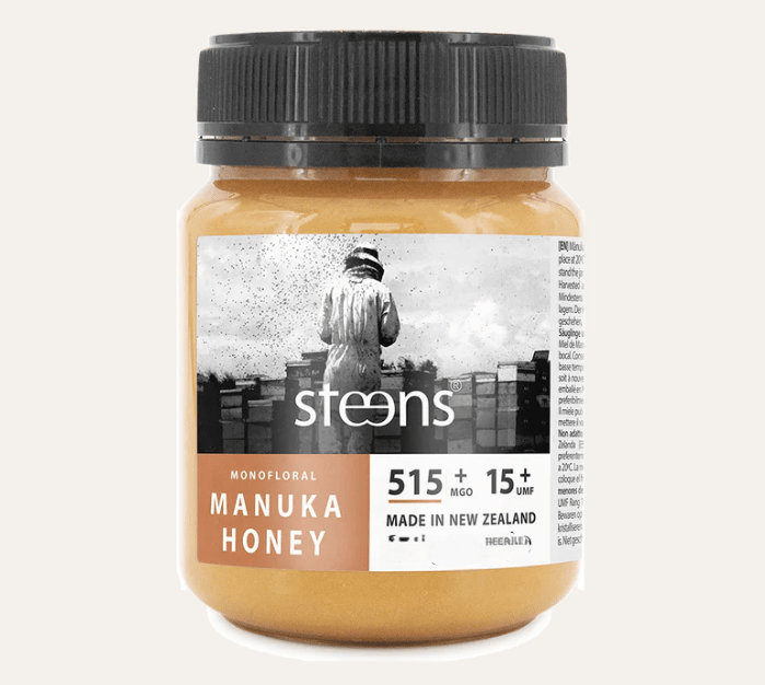 UMF15 Raw Manuka Honey 500g jar with label showing Monofloral and 515+ MGO, made in New Zealand.