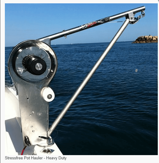 Cray Pot Hauler Heavy Duty mounted on a boat over the ocean, showcasing its durable design and functionality.