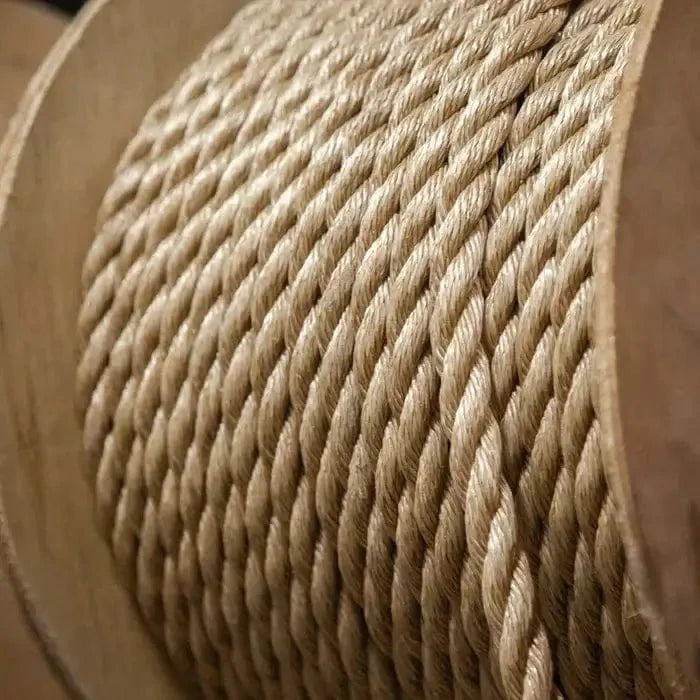 Tan Soft Lay Pro-Manila Rope 20mm x 250m Coils on a wooden spool, showcasing its durable and weathered look.