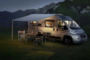 Thule 6300 Anodised Roof Mount Awning Mystic Grey - 3.50m installed on a camper van, offering shade and protection.