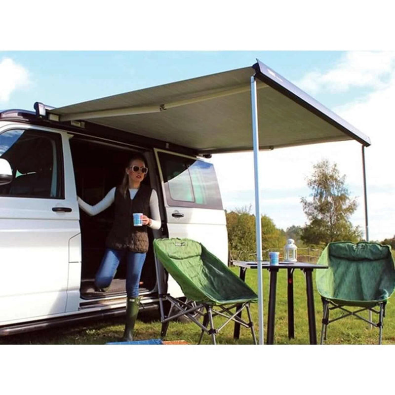 Thule 6300 Anthracite Roof Mount Awning Mystic Grey - 3.75m providing shade for outdoor seating.