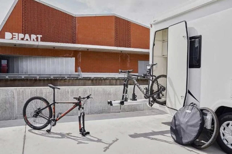 Thule VeloSlide Fork Mount Adapter - Quick Release used with bikes at a motorhome garage.