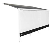 Thule Front Sunblocker 4.3m Long installed on awning, providing shade while allowing light and breeze.