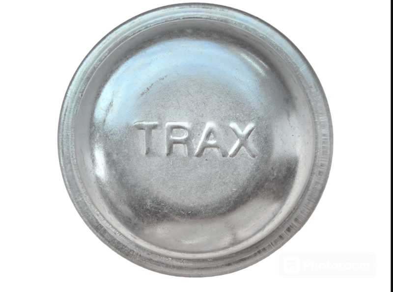 TRAX metal round hub cover designed for durability and performance, suitable for automotive applications.
